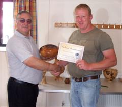 The monthly winner Tony Handford received his certificate from Paul Nesbitt